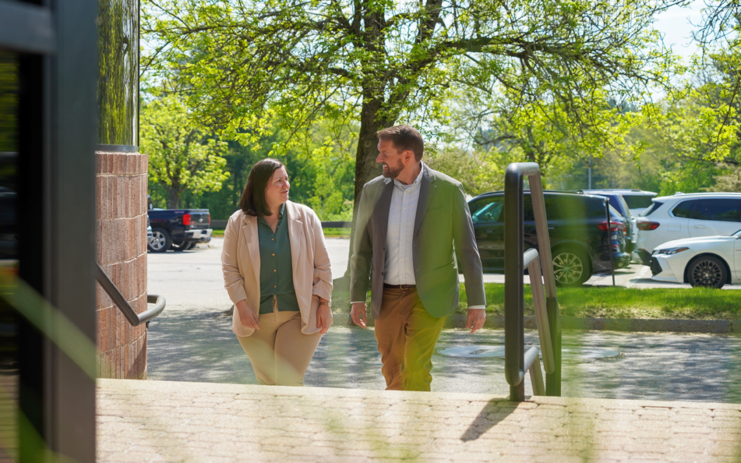 Transportation Practice Group staff Ben Martin and Stef Kizza walking outdoors